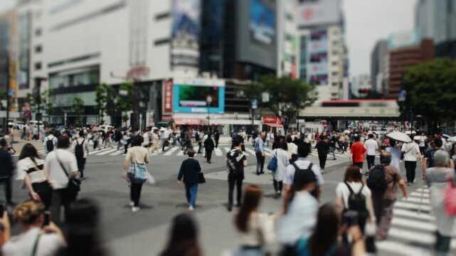 Miniature tilt-shift effect of crowd crossing shibuya intersection in tokyo