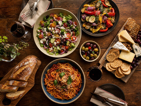 Dinner table with pasta and salad