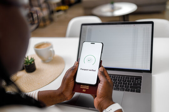 Smartphone scans passport for online check in and biometric verification at home office