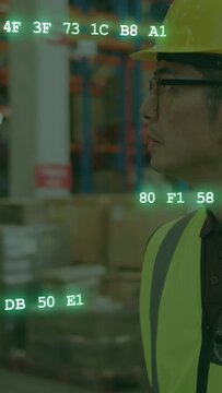 Vertical video: Warehouse man standing aisle scanner starting green codes across him tracking stock