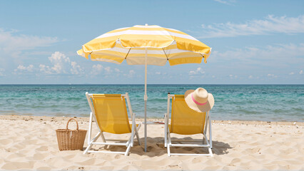Beach chairs and umbrella on a sandy beach