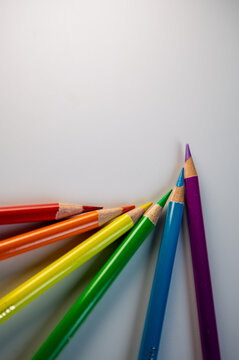 A Neat Arrangement of Colorful Pencils in a Diagonal Line on a Light Background