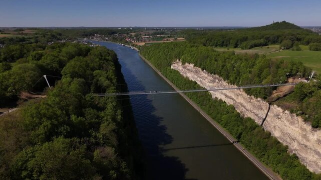 Bridge over the river Maas near Maastricht and Liege with tourists enjoying sunny weather at Petit Lanaye
