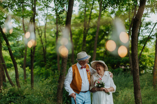 Senior couple having marriage in nature during spring day.