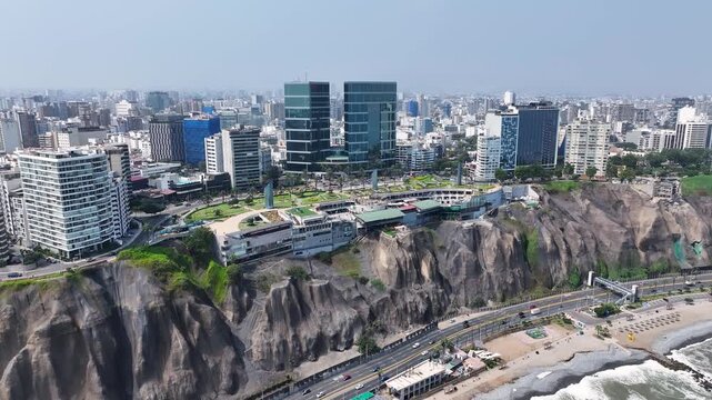 Larcomar Shopping Center In Lima Capital City Peru. Aerial View Of A Bustling City With High-Rise Buildings And Traffic. Coast Sky Seaside Summertime. Coast Outdoors Beach Scenic Coastline.