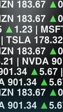 Vertical stock market ticker with glowing financial numbers and rising indicators, capturing fast moving investment data for fintech, trading and business media visuals