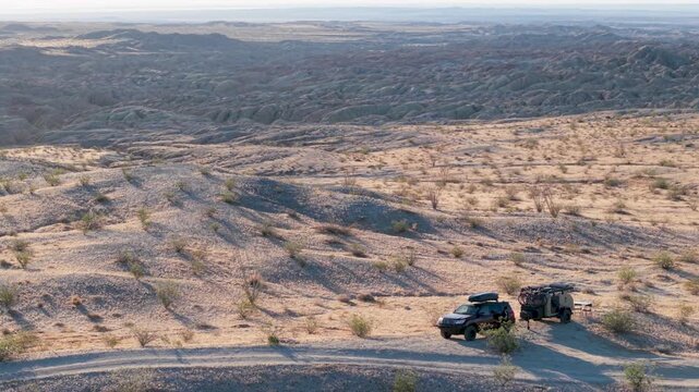 View aerial perspectives of a teardrop camper and SUV in Anza Borego Desert State Park along the Thimble Trail amid desert landscapes.