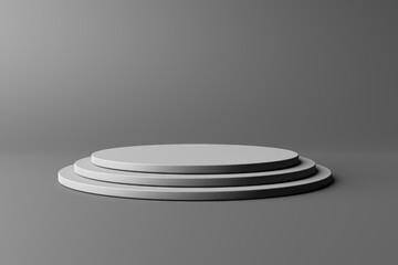 Three tiered round podium pedestal platform on a neutral gray background for product showcase and stage display layouts .3d render © VERSUSstudio