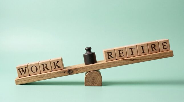 Wooden blocks spelling work and retire on seesaw scale balance, career life stage transition concept, planning for pension savings and future freedom from employment duties.