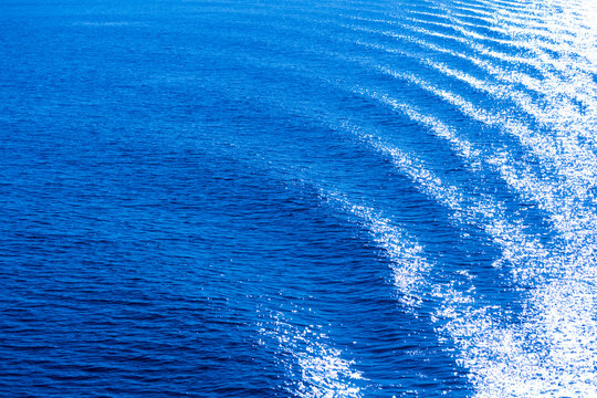 The surface of the ocean, blue water, ripples.