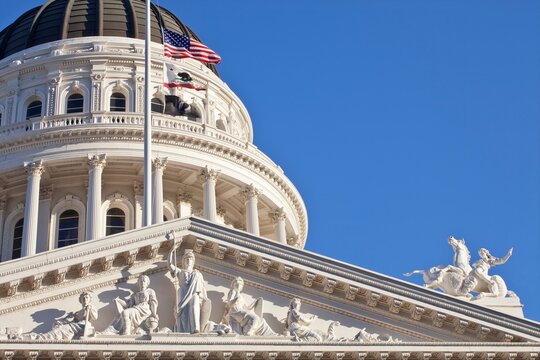 California State Capitol Building with American and California flags, Sacramento.