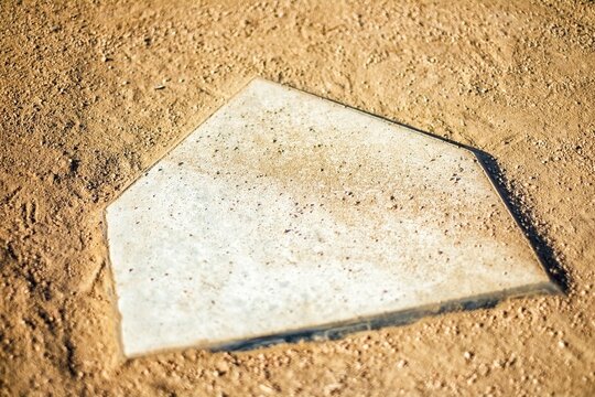 Home Plate on Baseball Field covered with dirt, top view