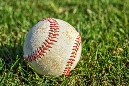 Closeup of baseball on lush green grass