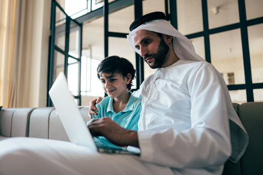 Traditional arabian family from Dubai spending time together at home