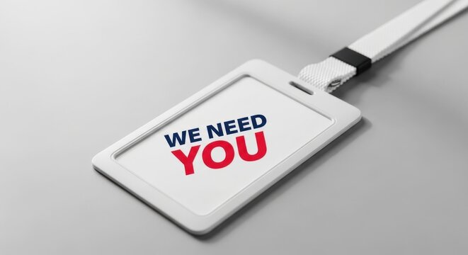 We Need You message on a white ID card holder with a lanyard recruitment concept.