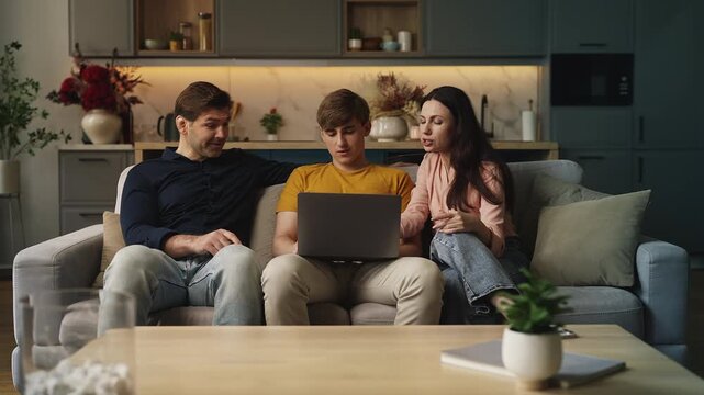 Teen son and his parents choosing a college on a laptop, planning for the future