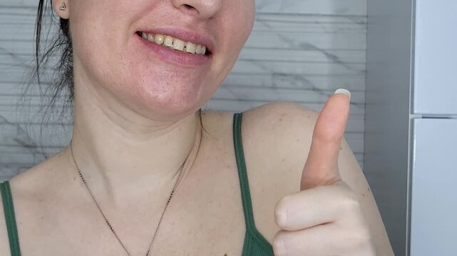 Young woman showing a problematic yellow smile, dental care and oral health checkup necessity