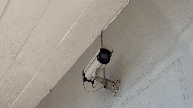 Surveillance Security camera in a suburban shopping complex.