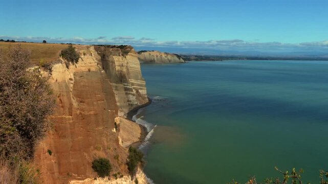 Scenic coastal landscape with high cliffs at Cape Kidnappers, New Zealand in aerial viw