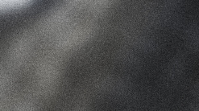 Gray textured surface with subtle light reflections on rough material