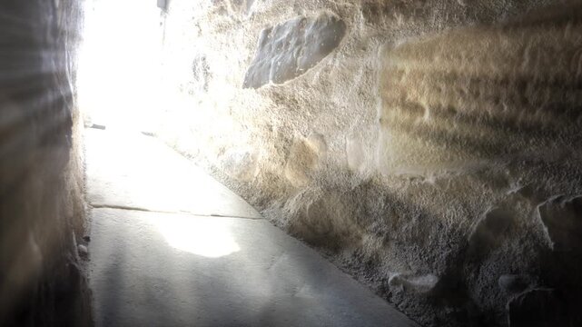 rising rays of sunlight in a crypt, symbolic background for religious holidays such as Easter, Pentecost, and Ascension Day