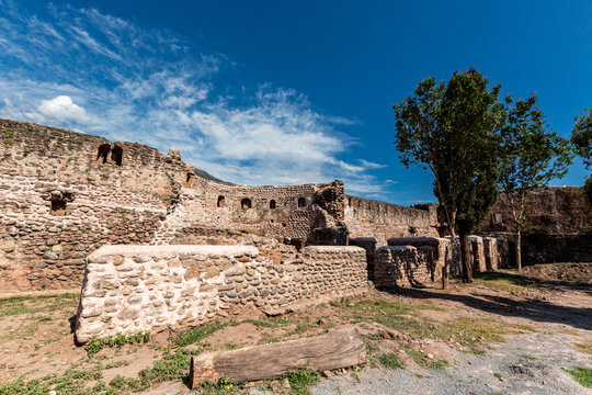View of the ancient stone walls and ruins of the Red Fort Muzaffarabad under a bright blue sky with wispy clouds Muzaffarabad, Azad Kashmir, Pakistan.