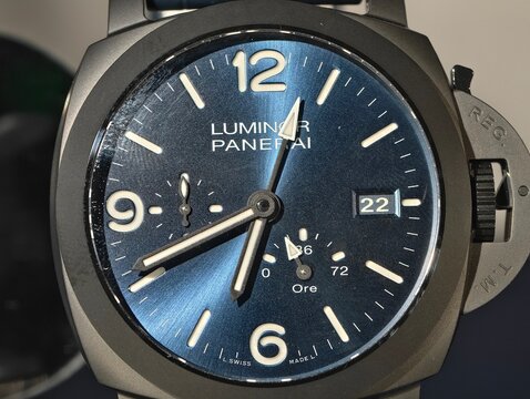 Shanghai,China-Nov.22nd 2025: Close-up of Panerai Luminor PAM01574 watch featuring a blue sun-brushed dial and linear power reserve indicator