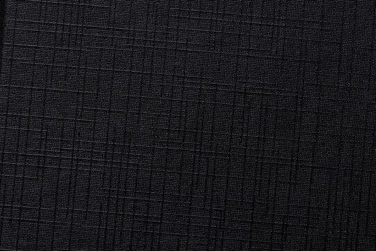 Macro Close-up of Black Ripstop Fabric Texture with Grid Pattern,High-detail macro shot of a durable black ripstop nylon material, showcasing the reinforced square grid weave and technical fiber.