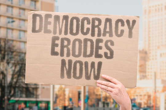 "Democracy Erodes Now" Democratic institutions weaken through legal manipulation. DEMOCRATIC. INSTITUTIONS. WEAKEN. INCREMENTAL. MANIPULATION.