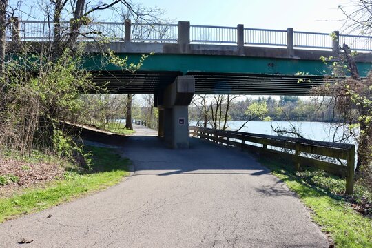 The pathway under the overpass in the park.