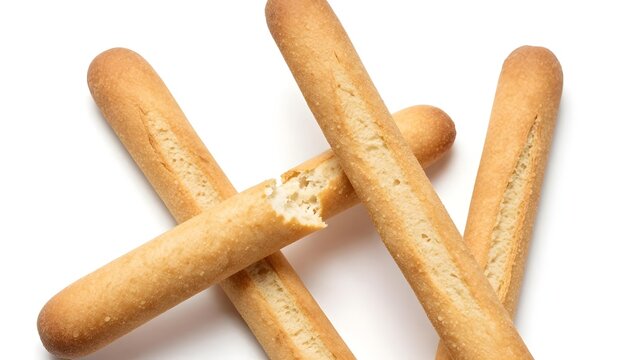 Golden brown breadsticks arranged in a studio shot with a white background