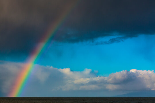 Rainbow over water with dark storm clouds on the Strait of Juan de Fuca, Port Angeles