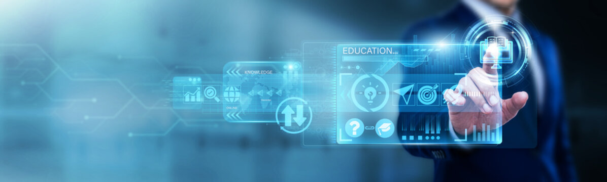 Educational Designer pointing at E-learning on a digital screen. Online courses, virtual classrooms, and remote skills training. Modernizing education through accessible digital tech.