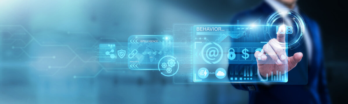Businessman pointing at IOB on a digital screen. Internet of Behavior, data tracking, and psychological insights. Analyzing human actions to influence consumer habits online.