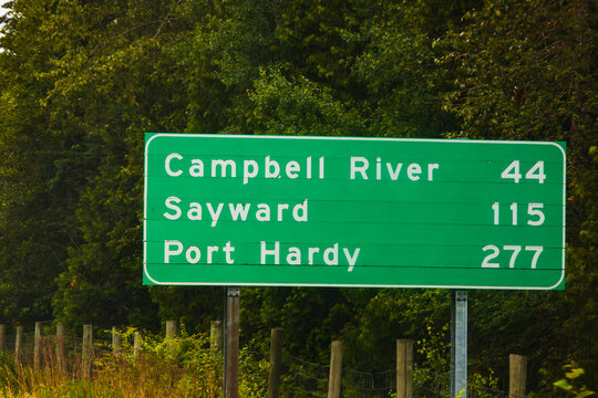 Road sign for Vancouver Island along Highway Highway 1, with mileage information