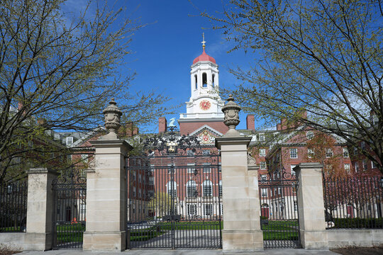 Harvard University, ornate gates leading to building with clocktower and cupola