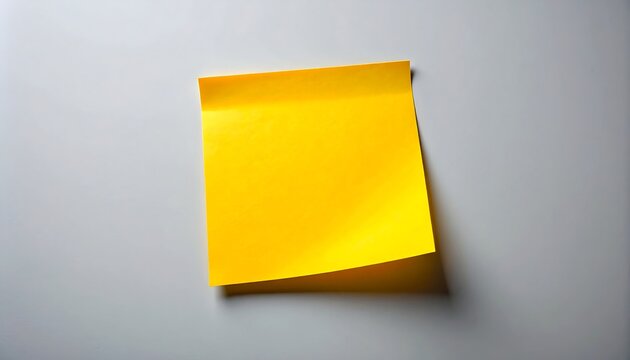 Vibrant Yellow Memo Note on a Neutral Gray Background for Minimal Reminder and Office Concept 