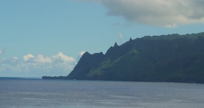 Napali Coast, Hawaii. Beautiful landscape of the Napali coastline with emerald-hued cliffs with razor-sharp ridges towering above the Pacific Ocean.