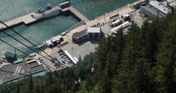 Juneau Goldbelt Tram cabins ascending to Mount Roberts and descending to the base terminal on South Franklin Street.