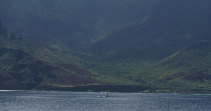 Napali Coast, Hawaii. Extraordinary Landscape of the Napali coastline with emerald-hued cliffs with razor-sharp ridges towering above the Pacific Ocean and deep, narrow valleys.
