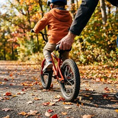 Fototapeta premium Parent Teaching Child to Ride Bicycle in Autumn Park