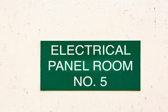 A green sign on a wall, Electrical Panel Room No. 5
