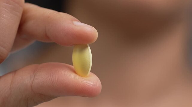 close up woman hand holding a medicine. Stop drug use Taking Medication Caring for the health care medical concept.	