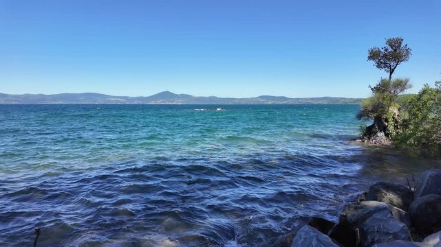 A view of the azure waters of Lake Bracciano, seen from Anguillara Sabazia - Lazio - Italy