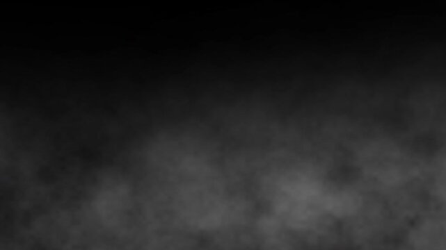 Fog smoke moving slowly against a black background