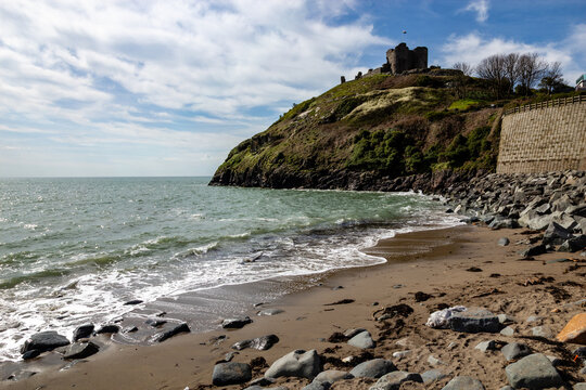 Criccieth Castle ruins viewed from the sandy beach in Wales
