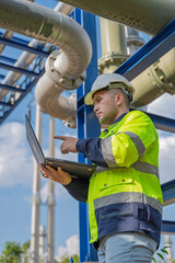 Industry specialists inspect massive piping at a gas-fired power plant integrated with a petroleum and oil refinery complex, focusing on maintenance for energy generation safety and efficiency.