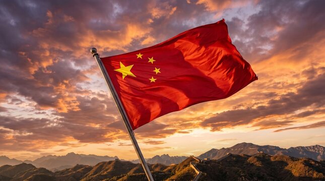 The chinese flag waving on the great wall of china at sunset with a stunning mountainous landscape