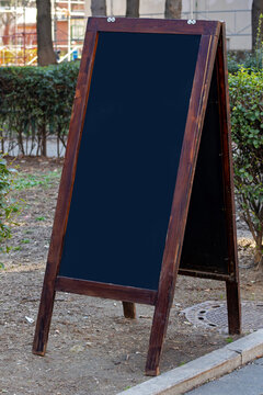 Empty blackboard for copy space outside on city street