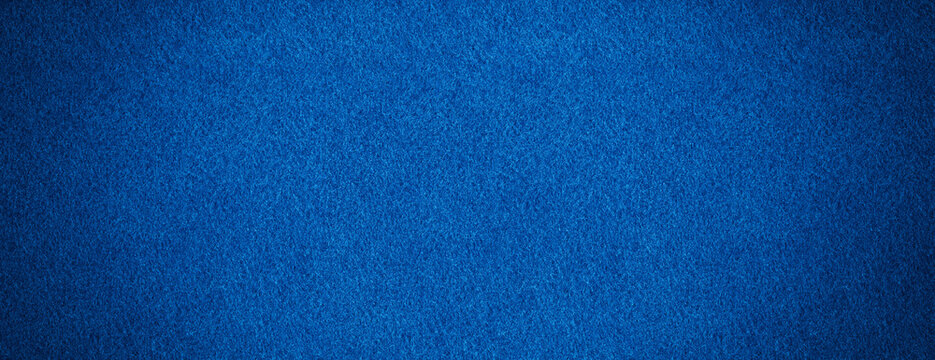 Blue color fabric background texture &ndash; dark cloth canvas surface. Long wide felt backdrop.